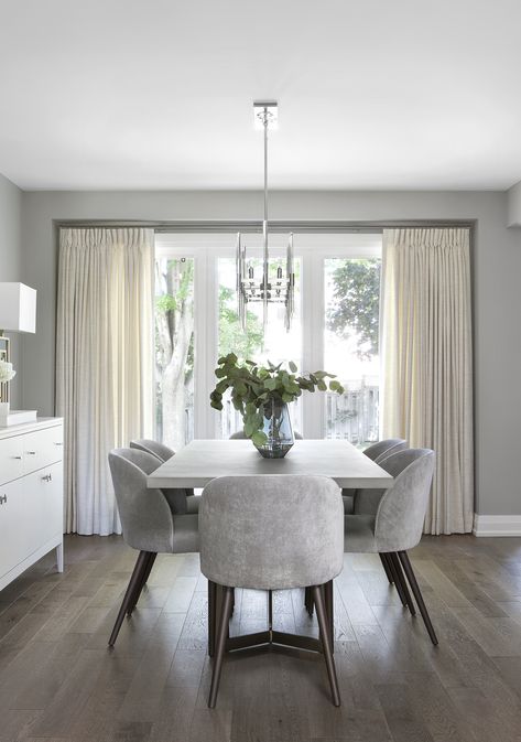 Dining Room With One Window, Relaxing Dining Room Ideas, White Dining Table Grey Chairs, Light Grey Dining Chairs, Gray Dining Chairs With Wood Table, Grey Dinner Room, Dreamy Dining Room, Grey Floor Dining Room, White And Grey Dining Room