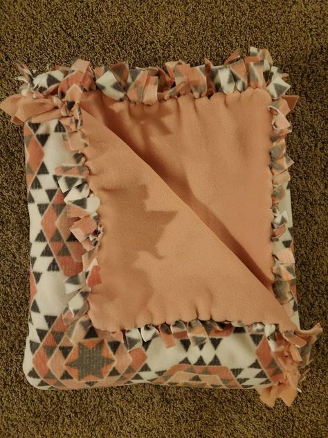 Large handmade fleece tie blanket with a calm and cultural  Aztec design. This warm cozy blanket is double sided with 2.5 yards of a strong yet relaxing anti-pill fleece. It has many shades of pink, including, coral, peach, salmon, and others. It also has some grays (grey), black, and white. This cute blanket is pretty warm and could be used alone for warmth. It is durable and can be machine washed and dried. I recommend machine washing on cold and tumble dry on low. It is handy for warmth, as a throw, or as a decorative cover. This welcoming and quality made blanket would be great to cuddle up with and relax as it conveniently fits two (or more) people comfortably.  This could make a great gift for any holiday, birthday, party, or even as a gift for yourself, which can be much needed at t Tie Blankets Fleece Patterns, Western Tie Blanket, Cute Tie Blankets Ideas, Fall Tie Blanket, Tie Blanket Ideas, Knot Blanket Fleece, Tie Blankets Fleece, Fleece Blanket No Sew, Tie Knot Blanket