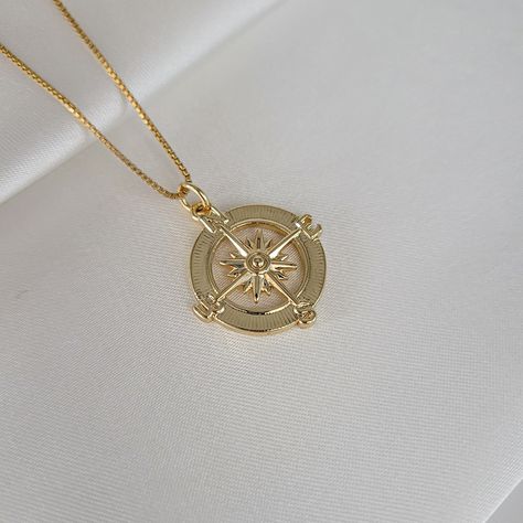 "Round gold compass pendant necklace. Wear it on it's own or layer it. Crafted on sturdy non tarnish 14K gold filled box chain. Pendant details:  * Finish: non tarnish 14K gold filled  * Size: 23mm x 19mm Comes in our gift ready packaging: vegan leather pouch for safe jewelry storing and branded box  Packaged and shipped with care from our studio located in sunny Tampa, FL GOLD FILLED Tarnish Resistant. Hypoallergenic. Long Lasting. Gold filled is affordable alternative to solid gold. Hypoallerg Gold Compass Necklace, Compass Pendant Necklace, Necklace Travel, Travel Necklace, Compass Pendant, Compass Necklace, Jewelry Words, Graduation Gifts For Her, Medallion Necklace