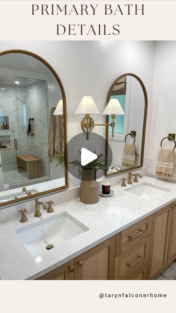 Taryn Falconer on Instagram: "PRIMARY BATHROOM DETAILS🫶🏼One of my favourite transformations last year was the primary bathroom. Details; •White oak vanity with quartz countertop •Champagne bronze fixtures •Ceramic (marble look) oversized tiles •Hexagon (marble look) glass tiles •Roman shades with remote •Arched mirrors •Tumbled brass towel hooks and rings •Teak shower bench •8.66” rain shower head •12” rain shower head •Marble and matte black door knob To SHOP this space head to my stories now or click the link in bio for my LTK! Follow me @tarynfalconerhome for more! Shop my home and get exclusive app only content by following me on LTK and AMAZON, link in bio! • • • #primarybathroom #bathroomdesign #neutralhome #transitionalmodern #homeinspo #luxurybath #masterbathroom #remod Champagne Bronze Bathroom Fixtures, Brass Towel Hooks, Champagne Bronze Bathroom, Bronze Bathroom Fixtures, Black Bathroom Fixtures, Front Room Decor, Teak Shower Bench, Bathroom Details, White Marble Bathrooms