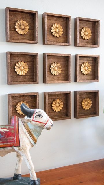 Mitesh | Home & Design on Instagram: "This was such an easy project with a big impact. I found these small wood plaques at the $1 bin @michaelsstores and knew they would work great for what I had in mind. I stained them in a walnut color along with wood rosettes from @amazon. I finished off the rosettes with RubnBuff in antique gold to give it the look of antique brass. Then they were ready for the wall. I grouped together 9 but you could do any number of arrangements. I wanted it to kind of loo Diwali Shoot, Diy Ideas For Home, Wooden Shelf Design, Wood Rosettes, Brass Wall Art, Indian Wall Decor, Shelves Design, Diwali Decoration Items, Antique Wall Decor