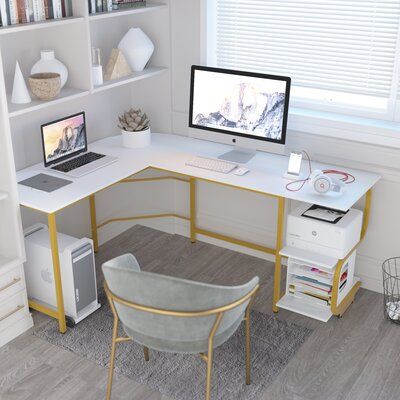 This clean-lined L-shaped desk offers a sleek industrial look and a modern, mixed-material design. The frame is crafted from steel and the tabletop and two convenient shelves are made from engineered wood in a striking hue. Designed for multi-purpose use, this desk is ideal for gaming, working from home, or writing the next great novel. Plus, it even boasts reversible orientation, so it's easy to incorporate into spaces of all configurations. Color (Top/Frame): White/Gold, Size: 29.3" H x 61" W