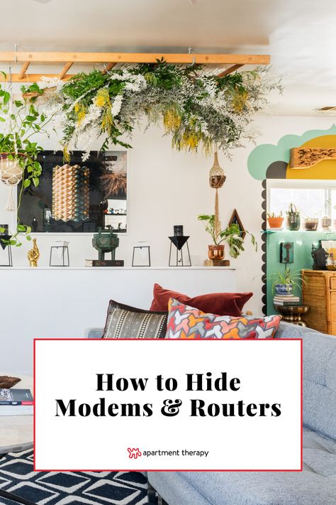 Discover how to hide unsightly Wi-Fi modems and routers with these designer tips. Hiding Electronics Living Rooms, Hide Router And Modem Wall, Hide Cords Behind Tv, Wifi Hiding Ideas, Internet Router Shelf, How To Hide Internet Router And Cords, Hiding Internet Modem Living Rooms, Hiding Xbox Console, Intercom Cover Ideas