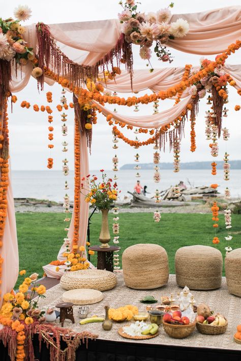 Marigold garlands, carnations, hanging amaranthus, cafe au lait dahlias and koko loko garden roses with draped fabric ceremony mandap flower design. Marigold Mandap Decoration, Mandap Flower Decoration, Indian Wedding Outside, Garden Indian Wedding, Colorful Wedding Ceremony Decor, Indian Wedding Florals, Minimalist Mandap, Outdoor Indian Wedding Mandap, Indian Mandap Decor