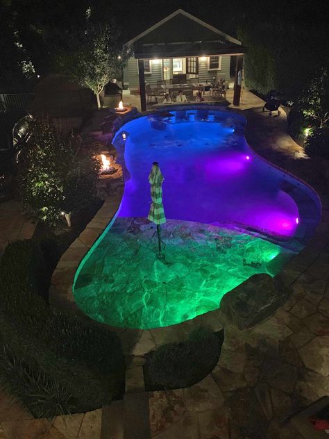 Landscape lighting, fire pits, LED pool lights, swim up bar, beach entry, bubblers Pool With Lights At Night, Pool Lights At Night, Pool With Led Lights, Swimming Pools Ideas, Pool Lighting Ideas, Pool Decorating Ideas, Florida Pools, Inground Pool Lights, Pool Business