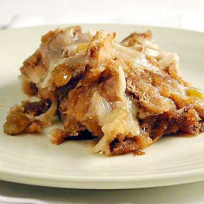 This capirotada, or Mexican bread pudding, features layers of nuts, cheese, dried fruit, and bread drizzled with cinnamon-infused sugar... Traditional Capirotada Recipe, Easy Capirotada Recipe, Mexican Bread Pudding Recipe, Mexican Pudding, Spanish Sweets, Lenten Desserts, Capirotada Recipe, Bunuelos Recipe, Mexican Bread Pudding