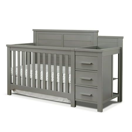 The Farmhouse crib and changer, another addition to Sorelle's most popular category, is functional and attractive, featuring three large storage draws, two shelves on the side for storage, and a changer on top which comes with a topper pad. For more functionality, the changer section is detachable and converts to a nightstand when the crib is converted to a full-size bed. Designed with a farmhouse look and available in a stylish weathered white or weathered gray finish, this crib can also be tur Farmhouse Crib, Farmhouse Cribs, Wood Crib, Bed Rails For Toddlers, Full Size Headboard, Two Shelves, Weathered White, Convertible Crib, Soft Bedding