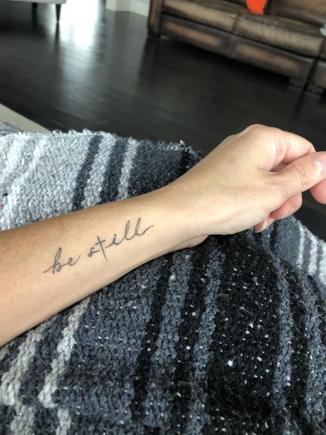 Tattoo, be still and know, “Be still in the presence of the Lord, and wait patiently for Him to act. Don’t worry about evil people who prosper or fret about their wicked schemes.” ‭‭Psalms‬ ‭37:7‬ ‭NLT‬‬ Be Still And Know Tattoo With Cross, Be Still Bible Verse Tattoo, Worry Tattoo Ideas, Be Still Hand Tattoo, Tattoo Be Still And Know, Scripture Tattoo Ideas For Women, Matthew 14:22-33 Tattoo, He Is Enough Tattoo, Lord’s Prayer Tattoo