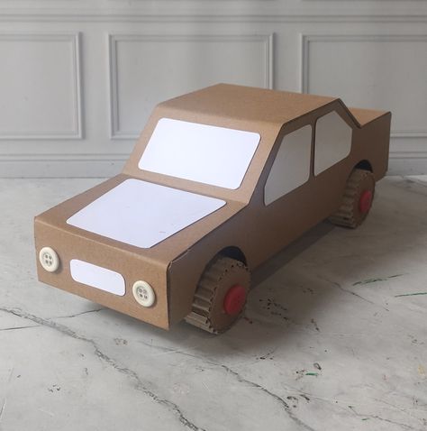 Cardboard craft Car Made Out Of Cardboard Boxes, Cardboard Car Ideas, How To Make A Cardboard Box Car, Surprise Auto, Car Out Of Cardboard, Cardboard Car Diy, Car From Cardboard, Diy Cardboard Car, Cardboard Cars