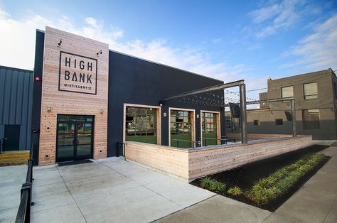 Entrance and patio space at High Bank Distillery Metal Building Renovation, Office Building Renovation, Shop Landscaping Ideas, Rustic Commercial Building, Exterior Warehouse Design, Commercial Patio Design, Metal Commercial Buildings, Commercial Metal Building Exterior, Business Entrance Ideas