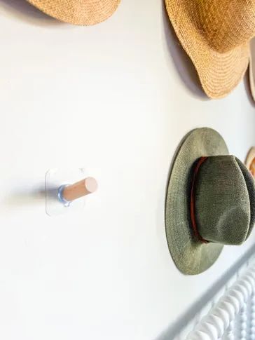 Adding hooks to our wall to complete the hat display. Hooks For Hats Wall, Hat Wall Hooks, Wide Brim Hat Storage, Cowboy Hat Storage Ideas Diy, How To Hang Cowboy Hats On Wall, How To Display Hats On A Wall, Hat Hook Ideas, Wall Hat Display, Wall Of Hats