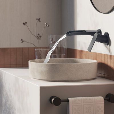 Influenced by modern home decor trends, wall-mounted faucets fit perfectly into the minimalist style. It not only saves space, but also brings a touch of modern elegance to the bathroom. The waterfall spout design on the upper opening allows you to clearly see every drop of water flowing out. Feel the collision with nature. All in all, just a great recommended product to decorate your bathroom. Finish: Black | Tomfaucet Wall Mounted Bathroom Faucet in Black | 9.2 H x 6.3 W x 2.76 D in | Wayfair Wall Faucet Bathroom, Modern Half Bathroom, Bathroom Wall Faucets, Midcentury Lighting, Waterfall Sink Faucet, Bathroom Faucets Black, Wall Mounted Bathroom Faucet, Wall Mount Faucet Bathroom Sink, Bathroom Sink Design