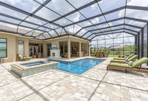 https://www.thespruce.com/swimming-pool-types-designs-and-styles-2737104 Covered Pool, Pool Screen Enclosure, Pool Screen, Pool Cage, Indoor Swimming Pool Design, Screened Pool, Florida Pool, Living Pool, Indoor Pools