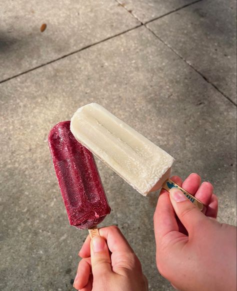 Two hands, each holding a popsicle. The one on the left is a dark raspberry color. The one on the right is white. Both have tan sticks at the bottom, there is still frost on them from being cold. Outshine Popsicles, Popsicle Aesthetic, Strawberry Popsicles, Ice Popsicle, Aesthetic Summer Vibes, Summer Popsicles, Wallpaper Summer, Summer Scenes, Baby Tattoos