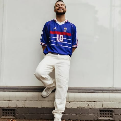 Vive La France , Vive le Football Elegance meets victory in the France 1998 home jersey. The iconic rooster emblem, the three proud stars, and the tricolor bands - it’s a masterpiece of design. With this jersey, you can reimagine France’s 1998 World Cup victory . Stand in the shadow of legends. Zinedine Zidane’s magical strikes, Emmanuel Petit’s last-gasp winner, and Marcel Desailly’s impenetrable defense. This jersey is the closest you can get to the stars who made a nation believe. #fran... France Jersey Outfit, Soccer Kit Outfit, Retro Soccer Jersey Outfit, France Kit, 90s Men Fashion, Bloke Core, France Jersey, 1998 World Cup, Jersey Fits