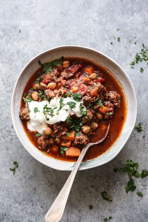 This lamb chili recipe is spiced with Moroccan harissa paste and slow cooked with sweet potatoes, chickpeas, and kale - a great fall gluten-free slow cooker recipe with Mediterranean flavors! | Feed Me Phoebe #FeedMePhoebe #chili #glutenfree #crockpotrecipe #slowcooker #easydinner Lamb Chili Recipe, Lamb Chili, Mediterranean Lamb, Ground Lamb Recipes, Moroccan Lamb, Moroccan Spices, Sweet Potato Chili, Lamb Stew, Pork Dinner