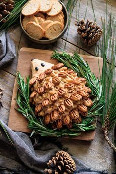 Woodland Hedgehog Cheese Ball: a simple, savory appetizer that will be a stunning centerpiece at a woodland baby shower or first birthday. Cream cheese, cheddar, Worcestershire sauce, and spices make this vegetarian snack idea a super cute, gender neutral munchie. | www.savortheflavour.com #woodland #babyshower #firstbirthday #hedgehog #cheeseball Hedgehog Cheese Ball, Aperitivos Para Baby Shower, Woodland Baby Shower Food, Baby Shower Appetizers, Woodland Hedgehog, Shower Appetizers, Vegetarian Snack, Cute Gender, Cheese Cheddar