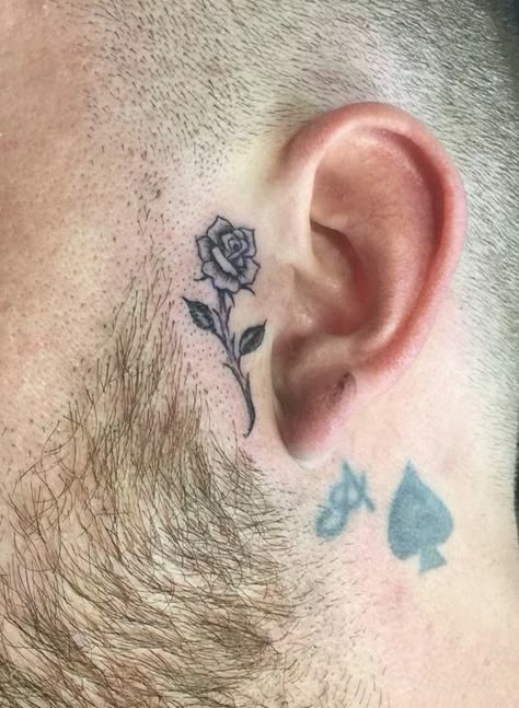 Rose Tattoo By Ear On Face, Rose Sideburn Tattoo, Small Rose Face Tattoo, Small Face Tattoos Men, Small Side Face Tattoo, Pink Face Tattoo, Rose Tattoo On Face, Side Burn Tattoos Men, Side Head Tattoo Men