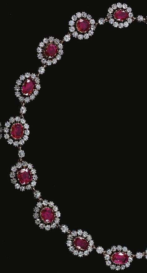 An antique ruby and diamond necklace, mid 19th Century. Designed as a series of graduated oval clusters, each set to the centre with an oval ruby within a cut-down collet surrounded by a border of similarly-set old-mine diamonds. #antique #necklace Victorian Mens Fashion 19th Century, 19th Century Homes, Victorian Mens Fashion, Mughal Jewelry, Ruby Necklace Designs, Ruby Jewelry Necklaces, Royal Jewellery, Ruby And Diamond Necklace, Diamond Necklace Designs