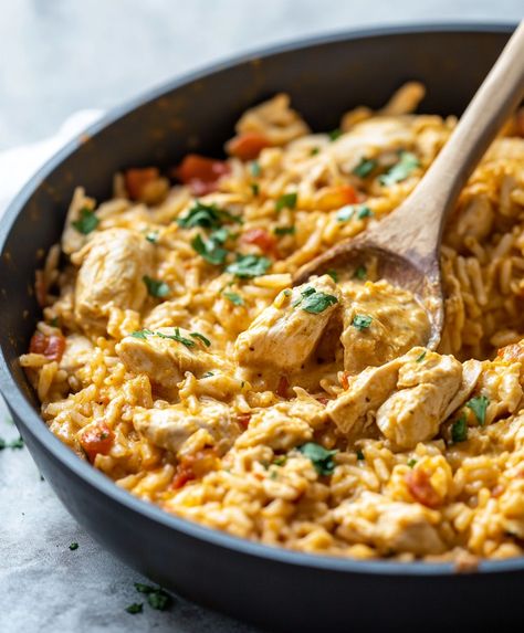 Cheesy and delicious Easy One Pot Queso Chicken and Rice, a simple and flavorful dinner ready in under 30 minutes! Spanish Rice Chicken Bowl, Easy Meals Over Rice, One Pan Mexican Chicken And Rice, Chicken And Rice Cheesy, Rice And Shredded Chicken Recipes, Queso Chicken Fajita Skillet, Chicken Queso Rice, One Pot Rice And Chicken, Mexican Chicken And Rice With Queso