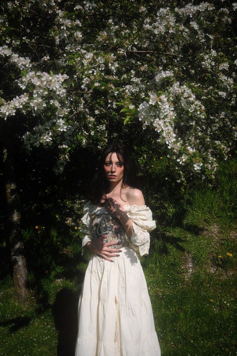 Cottage core aesthetic, dark alice in wonderland garden photoshoot, greenhouse, corset dress, spring 2023 outfit Aesthetic Spring Photoshoot, White Cottage Core Dress With Corset, Woman In Garden Aesthetic, Nature Debut Photoshoot, White Dress Nature Aesthetic, Cottage Core Corset Outfit, Corset Dress Photoshoot, White Dress Garden Photoshoot, Aesthetic Dress Photoshoot