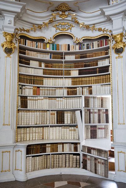 Jorge Royan / Via commons.wikimedia.org. Concave secret bookcase door + antique books + monastery environment = awesome. This secret bookcase door is inside Admont Abbey Library in Admont, Austria. I see a staircase there, I wonder where it leads? Bookcase Doors, Secret Doors, House Castle, Lots Of Books, Bookcase Door, Books Decor, Aesthetic Interior, Dream Library, Beautiful Library