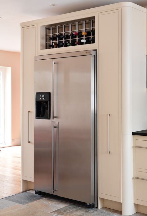 An example of a housing for an American fridge-freezer with pull-out larders and oak wine rack.  #kitchendesign #bespokekitchens Built In Fridge Freezer, American Fridge Freezer, Temecula Wineries, Refrigerator Cabinet, Larder Unit, American Fridge, American Fridge Freezers, Built In Cupboards, Kitchen Fridges