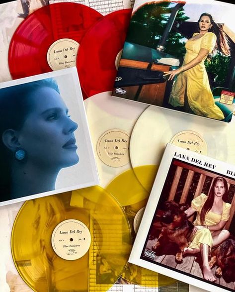 Daniel on Instagram: "Blue Banisters 🟡🔴⚪️ 🐕 @lanadelrey Pressing Color : -( Indies Exclusive Alternative Cover Transparent Red 2LP ) -( Limited Edition Alternative Cover Transparent Yellow 2LP ) -( Tansparent White 2LP ) -Size ( 12 in. ) -Size ( 12 in. ) -Released ( 2021 ) -Artist ( Lana Del Rey ) - Favorite Songs : - Thunder - Blue Banisters - Wildflower Wildfire - Living Legend - Arcadia - Dealer - Black Bathing Suit - Nectar of the Gods #lanadelrey #vinyl #album #2021 #bluebanisters # Blue Banisters Vinyl, Lana Background, Ldr Vinyl, Wildflower Wildfire, Nectar Of The Gods, Blue Banisters, Cd Aesthetic, Vinyl Record Display, Black Bathing Suit