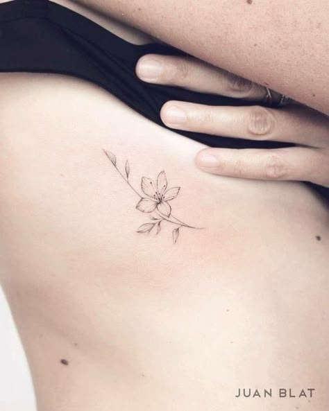 Dainty Flower Tattoos Lily, Small Lilies Tattoo, Minimal Lily Flower Tattoo, Lily Tattoo Dainty, Small Azalea Flower Tattoo, Daffodil Tattoo Ribs, Simple Flower Rib Tattoo, Lily Simple Tattoo, Daffodil Rib Tattoo