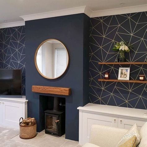 IMAGE: @ilovewallpaper.co.uk Chimney breasts make for such a valuable interiors feature in homes new and old. But how do we make the most of them? Architecturally, having a protruding wall makes for a focal point in the room, especially with the added jazz of a fireplace. And one of the simplest and most effective ways to decorate a feature like a chimney breast is with wallpaper. Chimney Breast Wallpaper, Living Room Design Blue, Antique Bookshelf, Log Burner Living Room, Navy Living Rooms, Feature Wall Living Room, Blue Living Room Decor, Gold Living, Gold Living Room