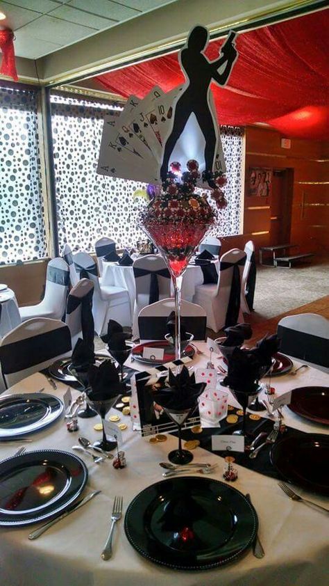 James Bond Casino Royale centerpiece James Bond Theme Party Dress Table Settings, 007 Party Centerpieces, 0050 James Bond Party, 007 Centerpiece, James Bond Centerpiece Ideas, James Bond Casino Royale Party, 007 Casino Royale Theme Party, James Bond Decorations, Casino Night Centerpieces