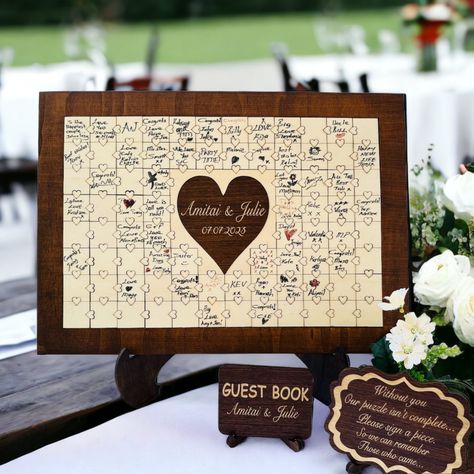 Our Rustic Wooden Puzzle Guest Book is the perfect alternative to a traditional guestbook. Create lasting memories with this customizable wood puzzle, where your guests can leave their heartfelt messages and wishes. This unique guestbook idea adds a rustic charm to your special day. Cherish the memories for years to come with this personalized wedding keepsake. Puzzle Guest Book Wedding, Wedding Guest Book Table, Puzzle Guest Book, Wedding Puzzle, Wooden Guest Book, Custom Guest Book, Wedding Guest Book Unique, Unique Guest Book, Guest Book Wedding