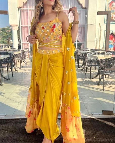 ₹2095 *RESTOCKED DISPATCH STARTS FROM SAT* ❤️❤️❤️❤️❤️❤️❤️ Design No-723 💃STUNNING WEDDING SEASON COLLECTION😍 💛NEW COLOR💛 🌸🌸🌸🌸🌸🌸🌸 This wedding season flaunt ur haldi and mehendi look with this glamorous sarong dress 😍😍😍😍😍😍😍😍 READY TO WEAR 3pcs DRESS EMBELLISHED WITH FOIL... Outfit For Haldi Function, Haldi Dress Ideas, Haldi Outfit For Bride, Mehendi Look, Mehendi Dress, Indian Outfits Modern, Haldi Ceremony Outfit, Haldi Dress, Haldi Outfits