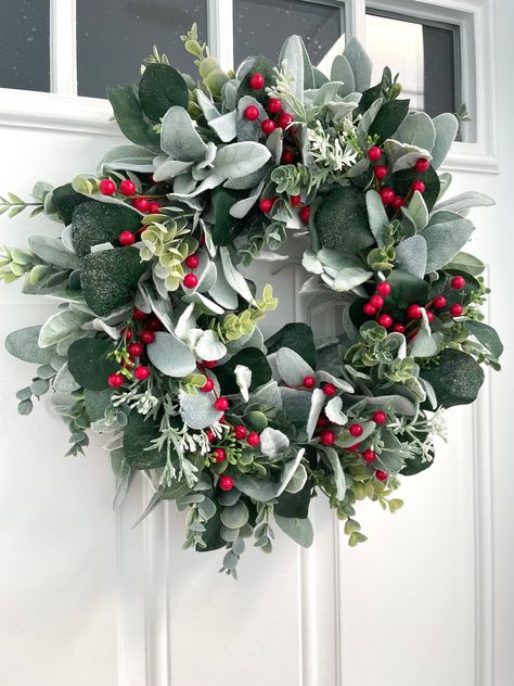 red berry wreath, winter lambs ear wreath, fall eucalyptus wreath, eucalyptus front door wreath, frosted eucalyptus wreath, valentine wreath Welcome your guests, family, and friends with this beautiful wreath! This wreath is made on a grapevine wreath, using red berries, frosted eucalyptus, lambs ear, small white berries, and green eucalyptus. Wreaths also make great gifts for mother's day, housewarmings, birthdays, bridal showers, weddings, Christmas, and more! This wreath is available in 3 sizes: - 15 inches ( pictures 1-2/ video) - 19 inches (pictures 4-10) - 23 inches (picture 3) The diameter is measured from leaf tip to leaf tip. **All wreaths are made with high-quality faux florals and greenery. Greenery and berries may vary due availability but always look pretty. Indoor use is reco Lambs Ear Wreaths, Eucalyptus Wreath Christmas, Lambs Ear Christmas Wreath, Eucalyptus Christmas Wreath, Diy Christmas Wreaths For Front Door, Red And Green Christmas Decor, Fall Eucalyptus Wreath, Winter Wreath Ideas, Christmas Eucalyptus