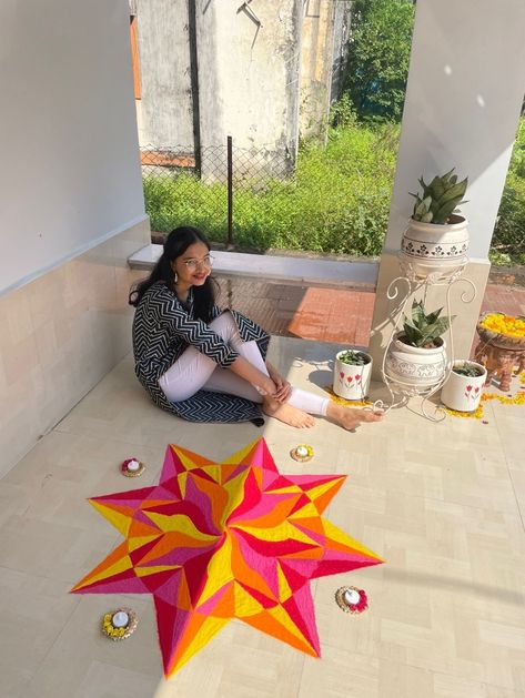 Pink red orange yellow rangoli in a circle gemoetrical pattern Rangoli With 3 Colours, Diwali Rangoli Circle, Circle Rangoli Designs Diwali, Geometric Rangoli Designs, Rangoli Circle, Yellow Rangoli, Poster Rangoli Designs For Diwali, Circle Rangoli Design, Geometric Rangoli