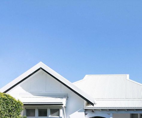 This all-white Californian bungalow is a relaxed haven California Bungalow Australian Facade, California Bungalow Australian, California Bungalow Exterior, California Bungalow Interior, Bungalow Landscaping, Concrete Tile Floor, Californian Bungalow, Steel Frame Doors, Bungalow Interior