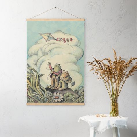 ▶ If you're a fan of the classic children's book series "Frog and Toad" by Arnold Lobel, then this Frog and Toad Wall Art Decor is a must-have for you. This charming poster captures the essence of the beloved book stories, featuring the lovable characters flying a kite. Whether you want to decorate a child's bedroom or add a touch of whimsy to your home decor, these prints are sure to delight. It's also a fantastic gift idea for friends, moms, or teachers who appreciate the magic of Frog and Toa Frog Wall Decor, Frog Nursery, Light Academia Decor, Arnold Lobel, Vintage Frog, Academia Decor, Kids Book Series, Classic Childrens Books, Nursery Room Inspiration