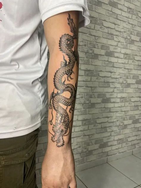 Dragon Tattoos 2024: Bold designs for men 18 ideas Dragon Tattoo Forearm, Dragon Tattoo Stencil, Black Dragon Tattoo, Hellboy Tattoo, Dragon Tattoo Arm, Tato Naga, Dragon Tattoo Ideas, Dragon Tattoos For Men, Unique Tattoos For Men