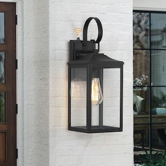 True Fine Norwich 1-Light 18-in H Black Dusk to Dawn LED Outdoor Wall Light in the Outdoor Wall Lights department at Lowes.com Black Farmhouse Outdoor Light Fixtures, Exterior Light Fixture Over Front Door, Black Outside Lights, Outdoor Wall Lights On House Garage, Door Lights Exterior, Outside Lights Front Door, Garage Door Lights Exterior, Outdoor Wall Sconces Exterior Lighting, Coach Lights Exterior