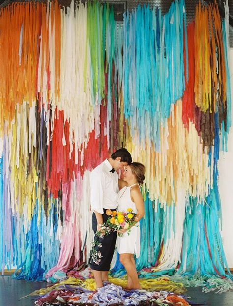 scene-stealing backdrop, photo by Ben Q Photography, backdrop by The Color Condition http://ruffledblog.com/color-pop-wedding-ideas #backdrops #weddingideas #garlands Decor Photobooth, Diy Streamers, Colorful Backdrop, Photo Booth Backdrop Wedding, Streamer Backdrop, Booth Backdrops, Diy Wedding Backdrop, Fringe Backdrops, Practical Wedding