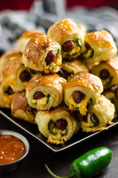 Jalapeno Popper Pigs in a Blanket. These spicy, cheesy appetizers are perfect for your next party or game day! Popper Pigs In A Blanket, Bite Size Appetizers Easy, List Of Appetizers, Super Bowl Menu, Cheesy Appetizer, Bite Size Appetizers, Jalapeno Popper, Pigs In A Blanket, Jalapeno Poppers