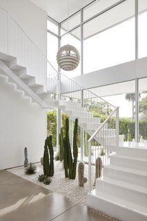 Photo 6 of 20 in A Frank Lloyd Wright Home With Unusual Materials Hits the Market at $3.4M - Dwell Indoor Cactus Garden, تحت الدرج, Casa Hobbit, Diy Staircase, Indoor Cactus, نباتات منزلية, Stairs Design Modern, Staircase Decor, Home Stairs Design