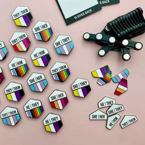 Mix and match two magnet tiles to craft a unique pronoun pin that's just right for you. Designed with versatility and personal flair in mind, these pins aren't just accessories - they're statements. Wear them your own way, switch them up easily, and make them completely unique to you. Whether you go for he/him, they/them, or something else, these pins are a fun and flexible way to showcase your identity. Size: This hexagonal pin set is 1.25in wide and 1.5in tall at the middle. Earth Flag, Magnet Tiles, Pride Badges, Stitch Quotes, Paper Dragon, Dragon Stuff, Monster Crafts, Bag Pins, Bridal Stores