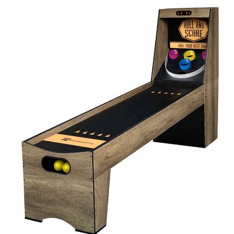 A durable and compact design with battery-powered electronic scoring and a gravity-fed ball return system, this classic game room arcade is fun for the whole family. This game table has a 5mm thick one-piece playing surface made of MDF with a laminated finish for smooth ball roll and active play. At 7’ 3” long, 20-1/2” wide, and about 4’ tall it’s the perfect size for most game rooms. Ball rolls are electronically scored when they enter one of the durable ABS scoring rings. Games can be played i Arcade Room In House, Dark Gaming Room, Hangout Room Ideas Teen Lounge, Teenage Hangout, Game Room Arcade, Teen Basement, Hangout Room Ideas, Teen Game Rooms, Geek Bar