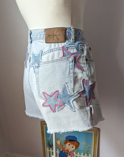 Reworked Patchwork Star Shorts by Sensible Slacks. These vintage cutoff denim shorts are repaired and reworked with handmade star patches. #upcycledfashion #reworkeddenim #patchworkdenim Denim Patches Diy, Diy Denim Shorts, Denim Stars, Reworked Jeans, Patchwork Star, Reworked Clothes, Reworked Denim, Reworked Clothing, Star Shorts