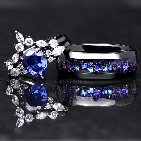 Blue Diamond Wedding Ring Sets, Black And Sapphire Blue Wedding, Space Themed Wedding Rings, Blue And Purple Wedding Rings, Royal Blue And Silver Wedding Rings, Blue Purple Black Wedding Theme, Sapphire Wedding Theme, Black And Blue Wedding Ring, Black And Blue Wedding Rings