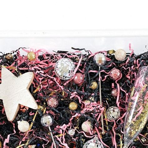 Ashley • Family Activities, Kids Sensory, and Homeschool on Instagram: "new years sensory play ⭐️💕🥂  threw a bunch of new years themed colors/things in a bin for the kids to play with: paper shred, disco balls, disco ball stir sticks, filler balls, champagne flutes, confetti, and an @oak.and.co star!  swipe to see last years version of this bin as well as another fun sensory bin idea: disco ball sorting! ✨  #sensoryplay #sensorybin #sensorybins #sensory #sensoryactivity #activitiesforkids #kidsactivities #activitiesfortoddlers #activitiesforchildren #activitiesforpreschoolers #childrensactivities #montessori #montessoriactivity #boymom #girlmom #momlife #momstagram #momfluencer #mominfluencer #momsofinstagram #momsupportingmoms #newyear #newyears #happynewyear" New Years Sensory Bin, New Year Sensory Bin, Sensory Table, Kids Sensory, Sensory Bin, Stir Sticks, Disco Balls, Montessori Activities, Sensory Bins