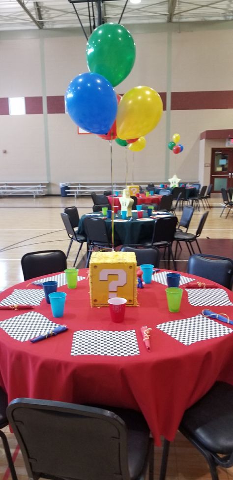 Super Mario Table Centerpieces, Video Game Baby Shower Theme, Mario Birthday Party Table Decorations, Video Game Baby Shower Ideas, Gamer Baby Shower Ideas, Super Mario Gender Reveal, Super Mario Bros Centerpiece Ideas, Super Mario Table Decorations, Mario Baby Shower Ideas