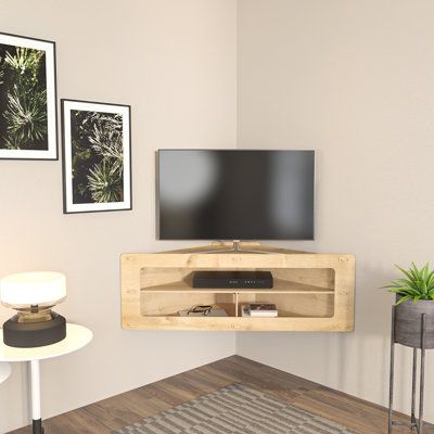 Introducing the corner TV stand - a sleek and stylish addition to your home entertainment setup. Crafted from durable 8mm MDF, this stand is built to last and features three spacious open shelves for your media devices, accessories, and decorative items. The screwless and timeless design of this wall-mounted stand gives your living space a modern, futuristic vibe. Plus, its space-saving design is perfect for small apartments or rooms where floor space is limited. Assembly is a breeze with the in Tv Wall Decor Living Room Small Space, Corner Tv Stand Ideas Living Rooms Small Spaces, Wall Mounted Tv Stand Ideas, Small Tv Space, Mounted Tv Corner, Bedroom Tv Wall Ideas Small Spaces, Small Tv Stand Ideas, Corner Mounted Tv Living Room, Tv Corner Wall Ideas