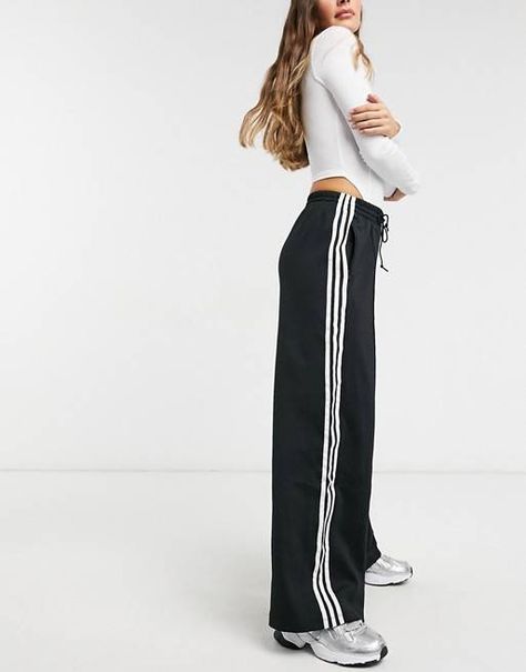 The 17 Best Track Pants That Are On-Trend for 2021 | Who What Wear Sweat Adidas, Adidas Hose, Striped Wide Leg Trousers, Sporty Pants, Moda Streetwear, Streetwear Mode, Striped Wide Leg Pants, Pant Trends, Outfit Formulas